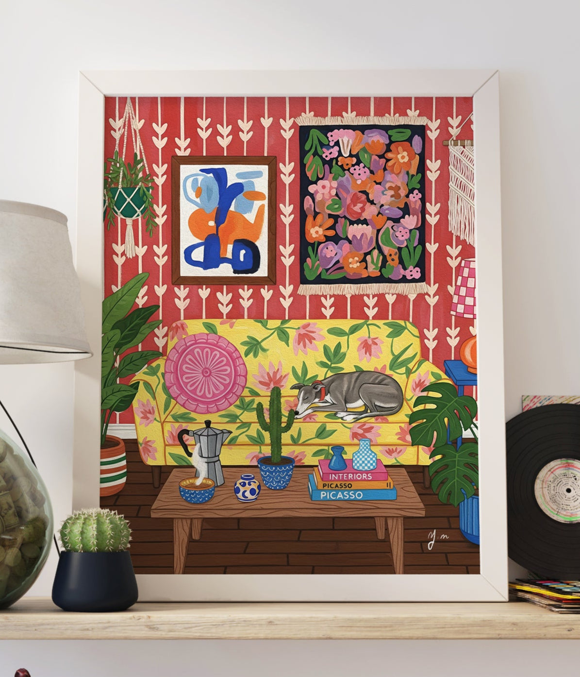 Illustration of a greyhound sleeping on a yellow couch covered in pink floral patterns inside a colorful bohemian living room with red patterned wallpaper, abstract wall art, a floral tapestry, macramé, potted plants, a cactus on a coffee table, and art books.