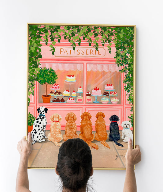 Adorable Puppies Sitting in a Row Waiting for Treats in Front of a Whimsical Pastry & Dessert Shop